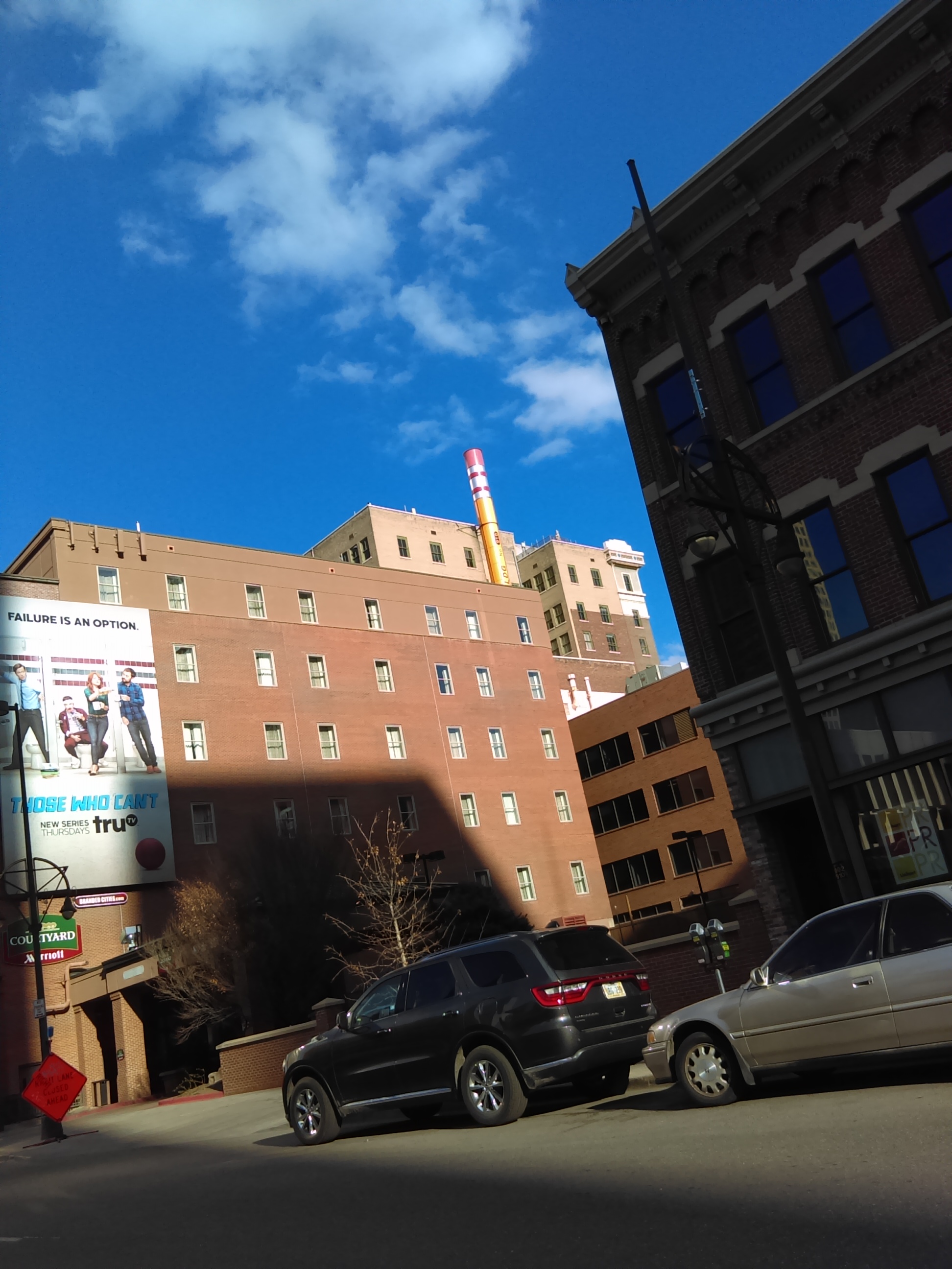 There is a building in Downtown Denver with a pencil for a smoke stack…