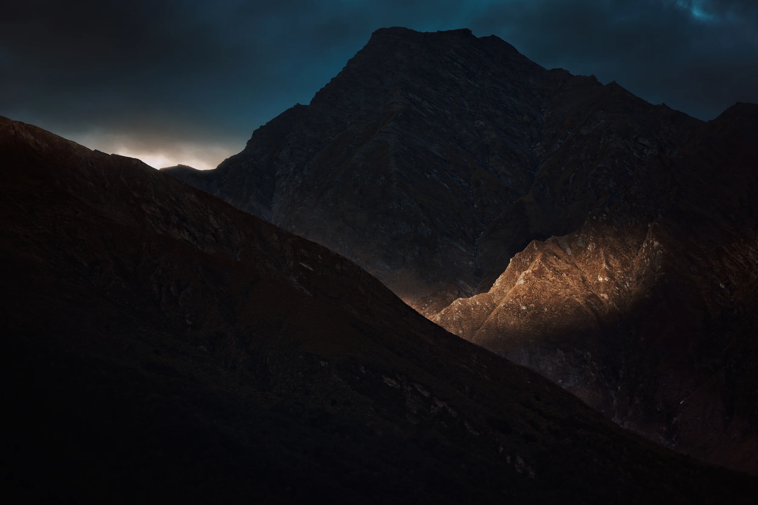 Quiet clouds rolled in again, tucking the mountains in and that late, late light of the setting sun on the warm skins of mountaintops we began to wind down too.