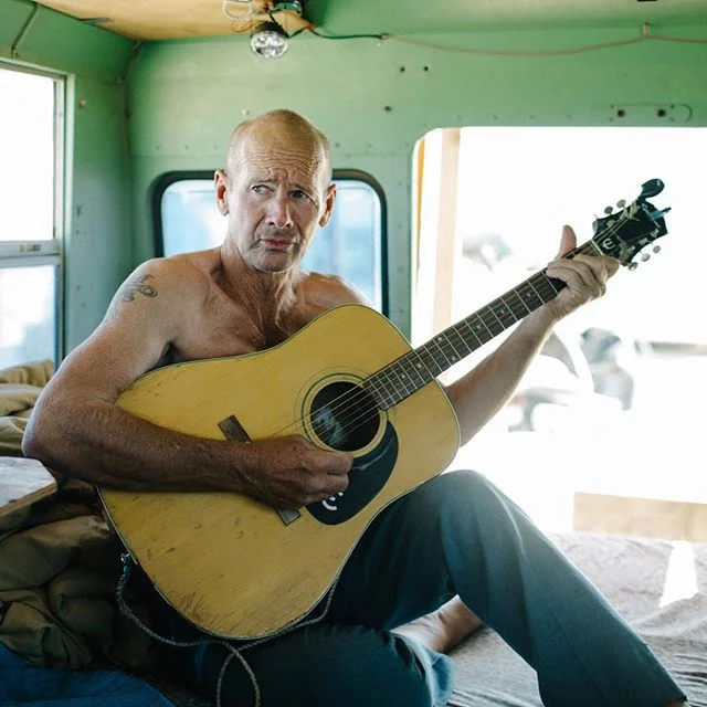 Slab City XX // Randall, who famously cooks the best catfish in Slab City, packed up life in Texas and took his bus on the road, accompanied by his beloved dog, fishing pole and guitar.