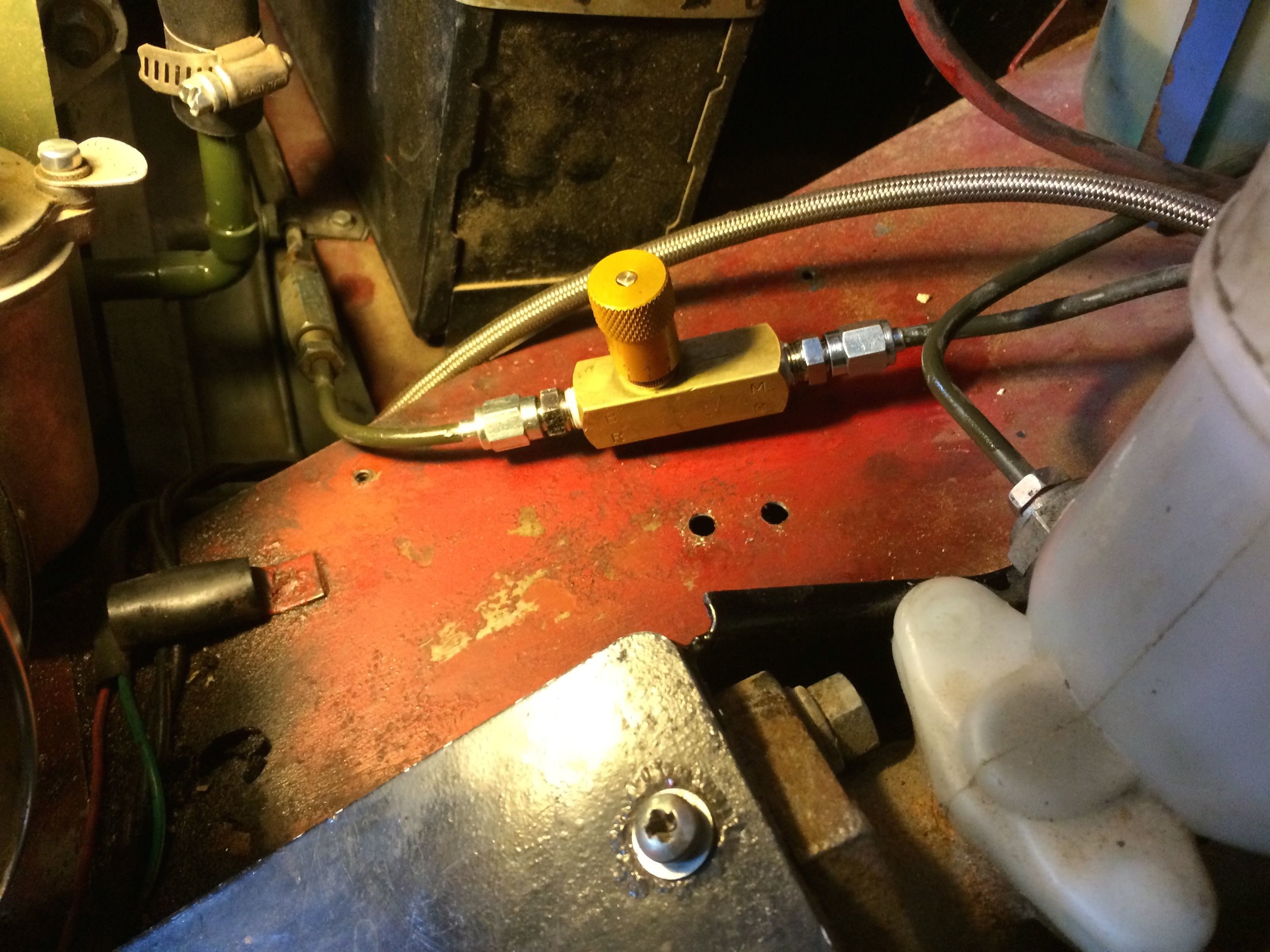 The holes are from the old Wilwood valve, which was larger and required a bracket. The Deltrol valve pictured is very small and a bracket is optional.