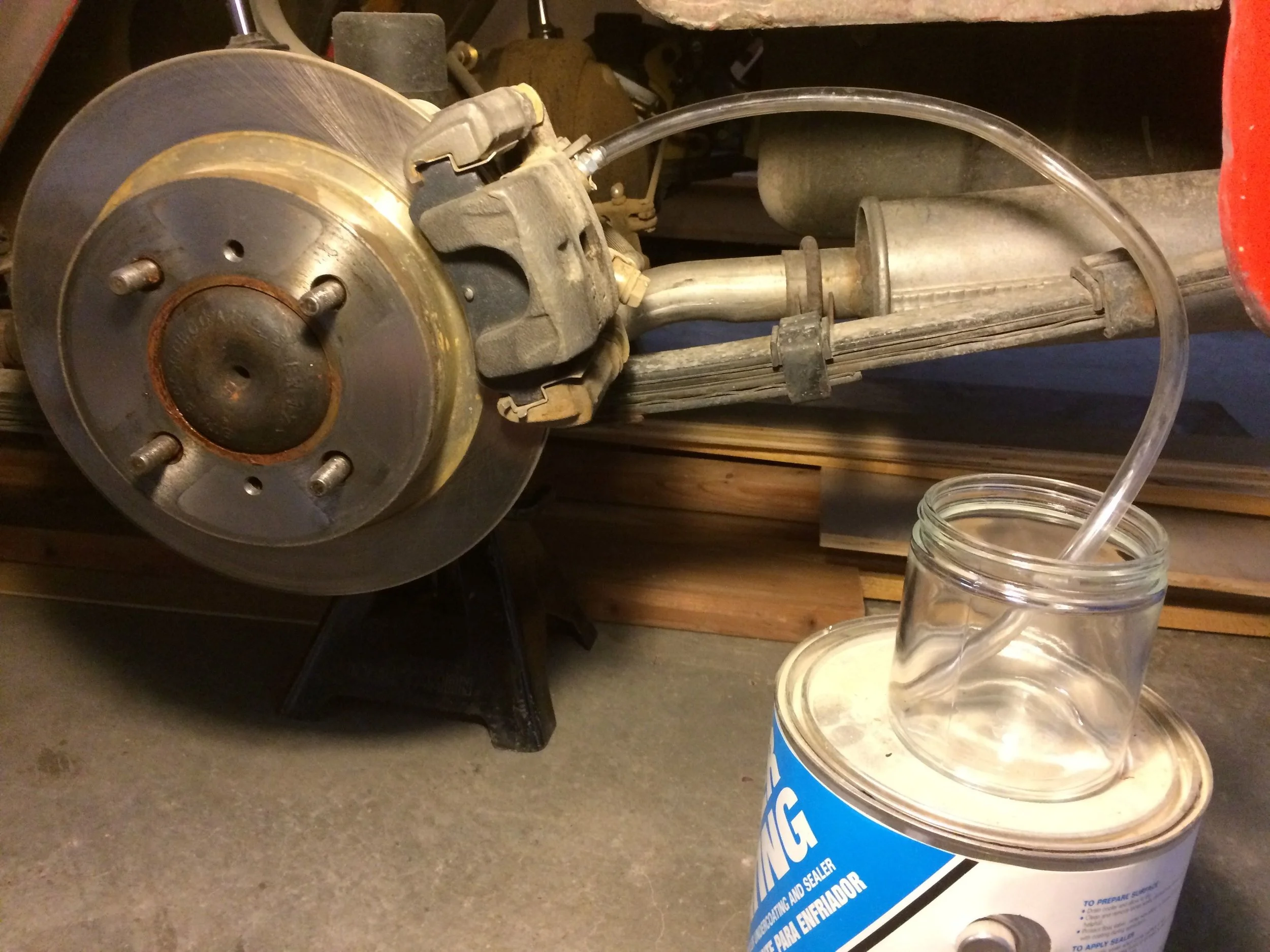 One-man bleeding is a snap with a power bleeder, vinyl tubing, and a jar.