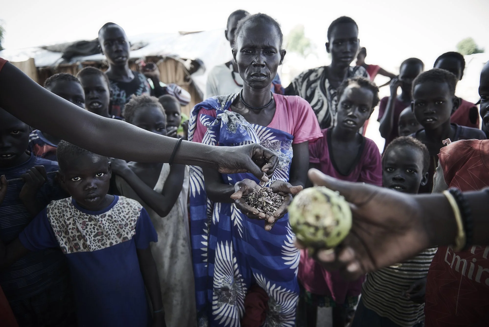 Mary Nyantey is 40 years old. When her village flooded and she was forced to flee, she could not carry her children through the floodwaters. Instead, she tied her children inside a sack made from a large plastic tarp (previously used to cover her ho