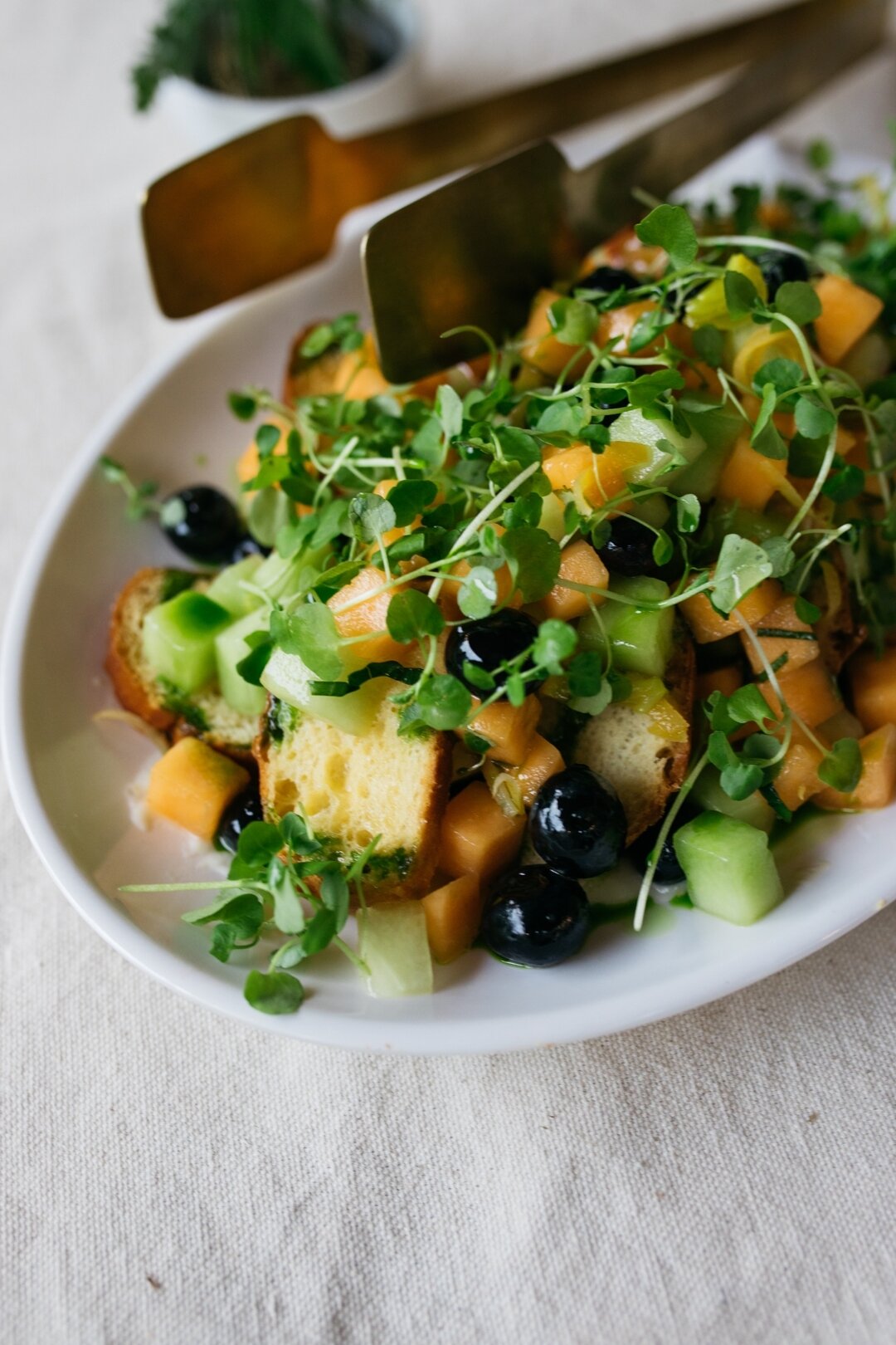 Every bite tells a story in our Melon and Blueberry Salad with Honey Lemon Confit, Brioche Croutons, Watercress, and Sweet Onions #homespunatl
 
Photo by @morganbeatton