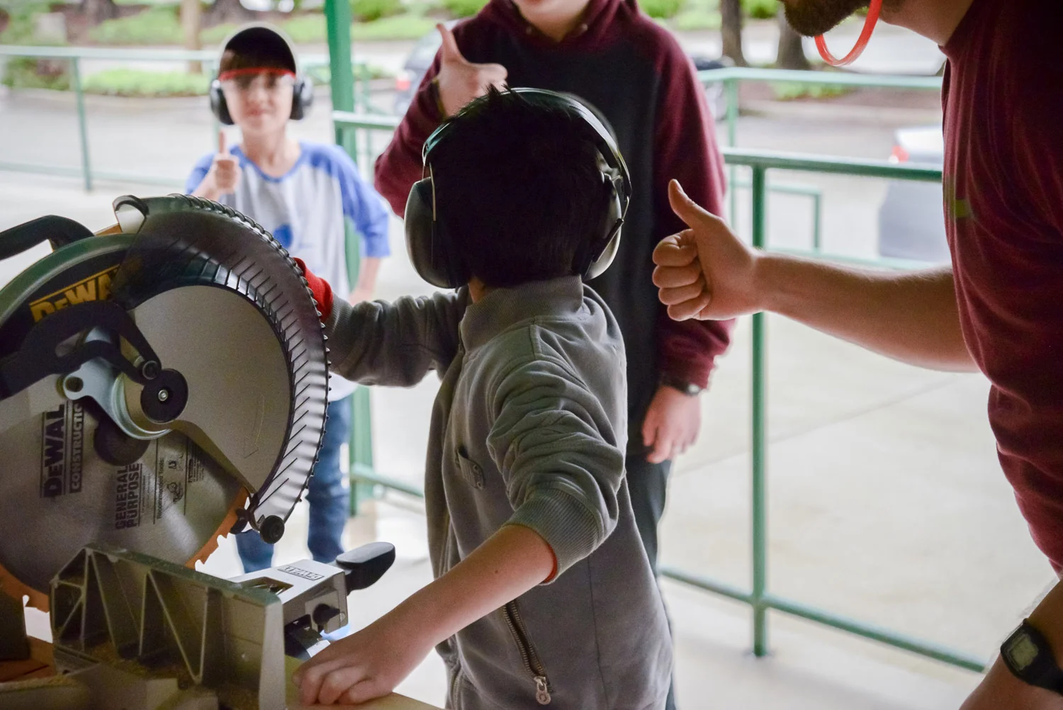 Lev makes a ready call. The rest of the team gives him a silent thumbs up to acknowledge that they've got their safety equipment on, are paying attention, and don't see anything dangerous about the way Lev has set up his cut.