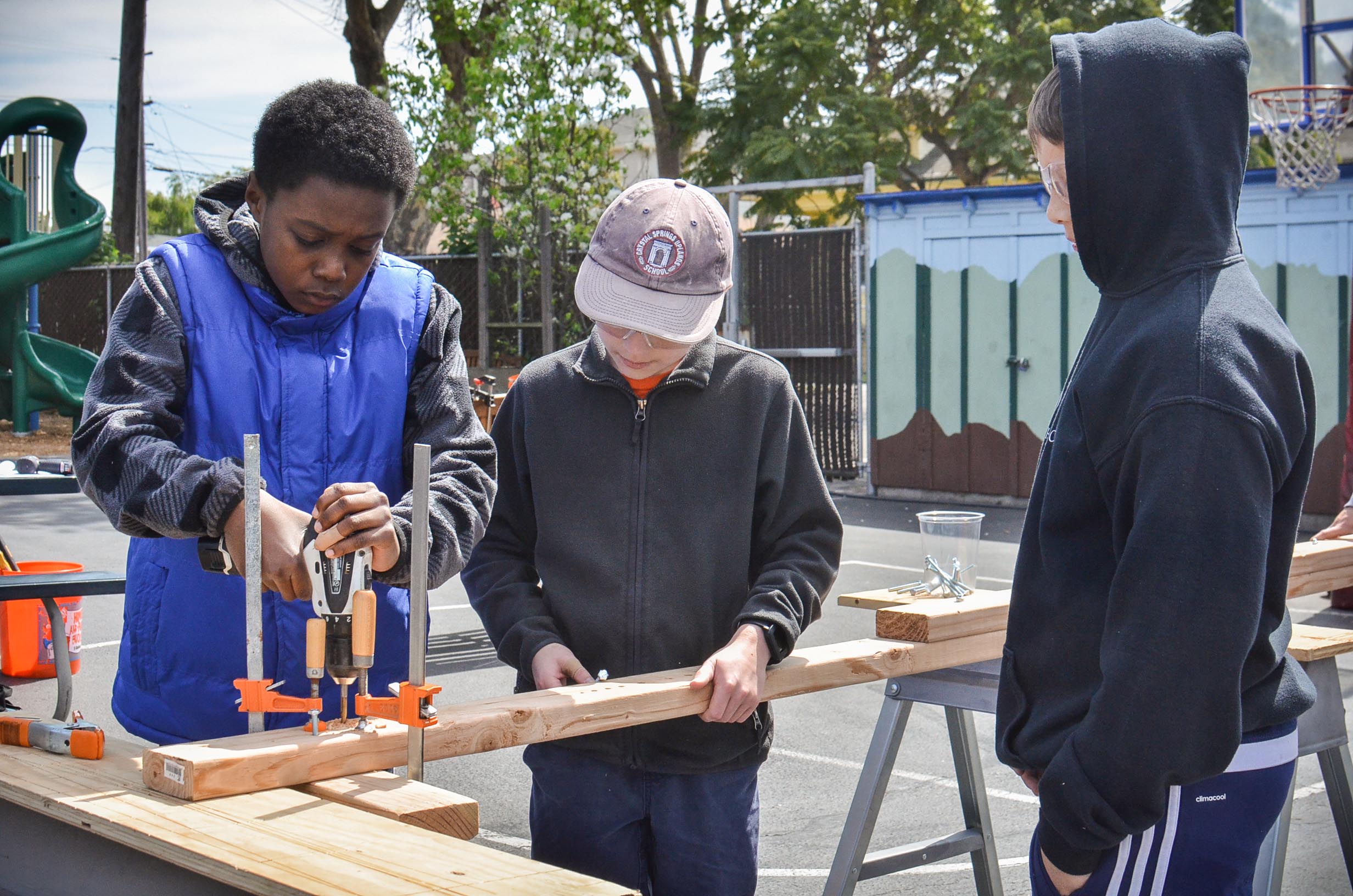 Taj, Benjamin and Ryan try a new placement for the wheels on the cue.