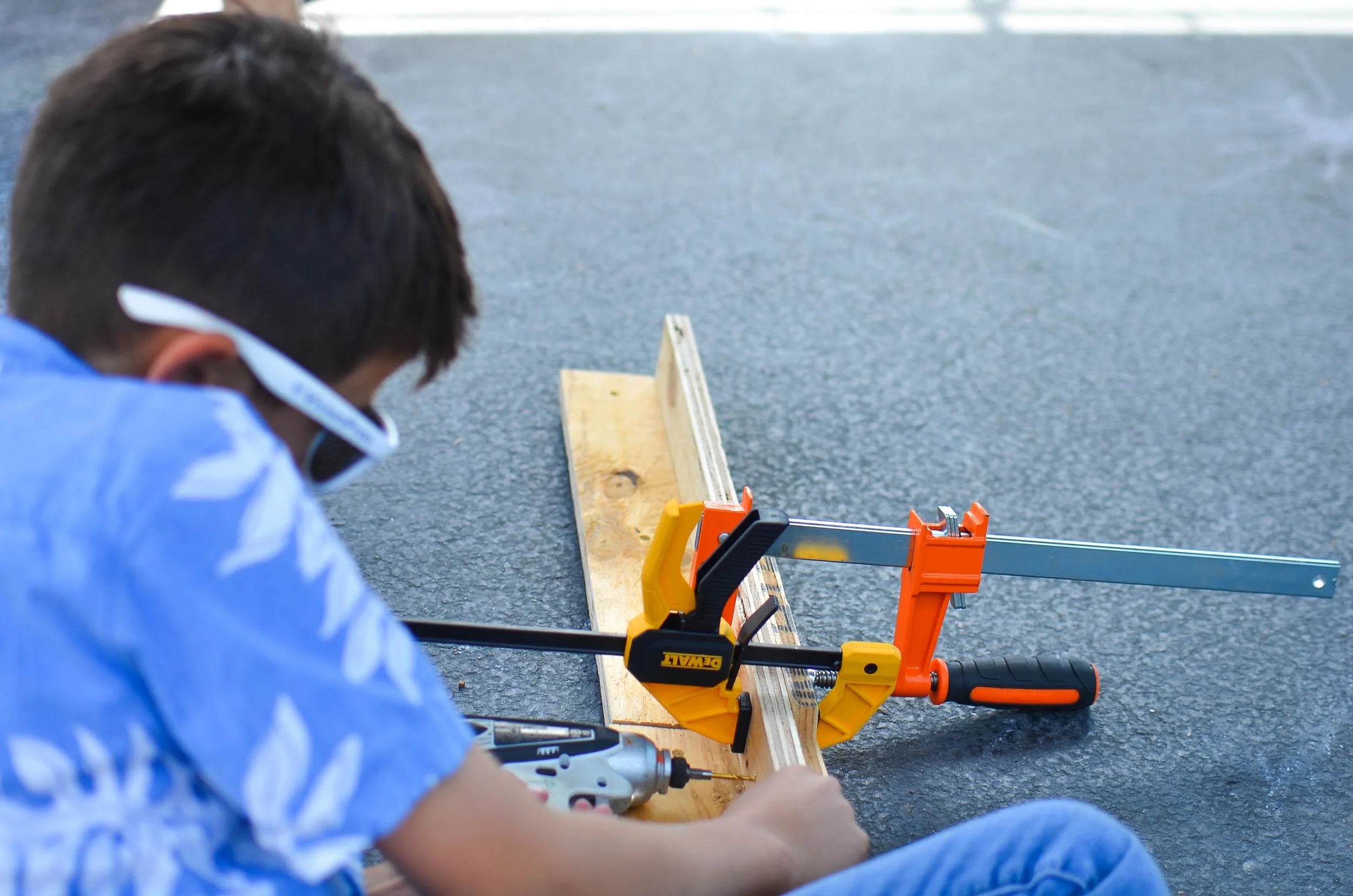 Benjamin gets an assist while drilling from the clamps.