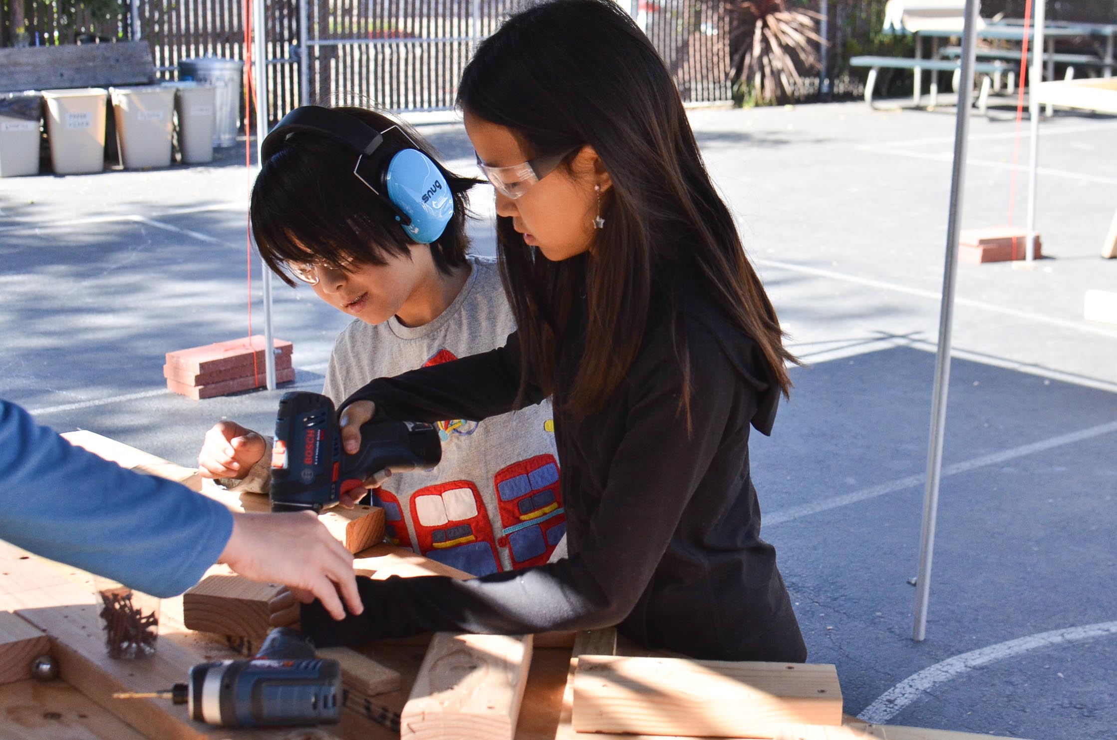  Christina and Davi work together on attaching more zig zags.&nbsp; 