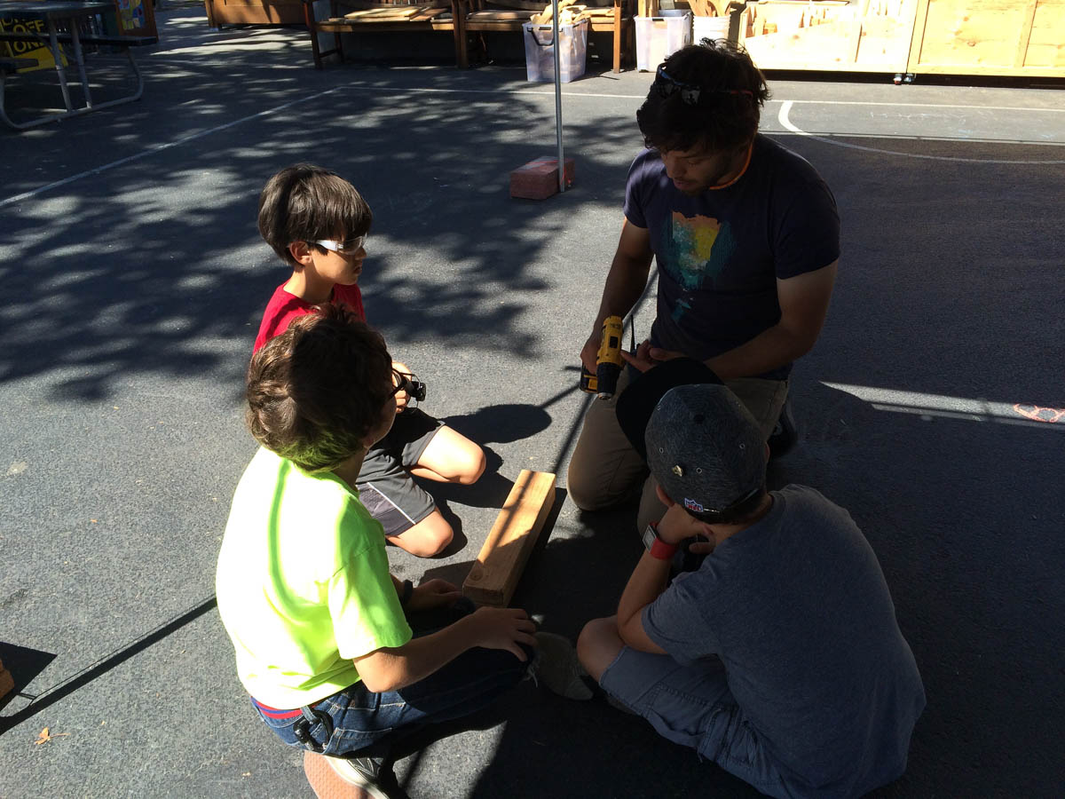 Our three alumni campers; Robert, Arson and Tasso recapping their tool knowledge with Josh