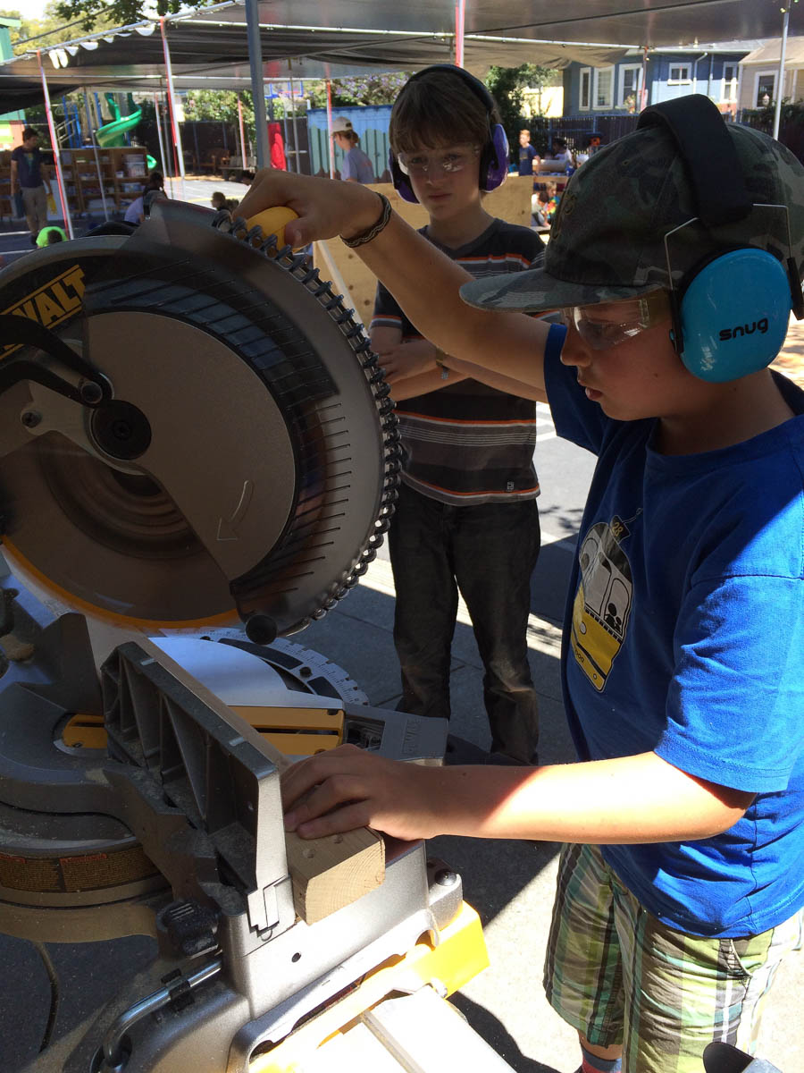 Rudy demonstrating how to cut at an angle on the miter saw.