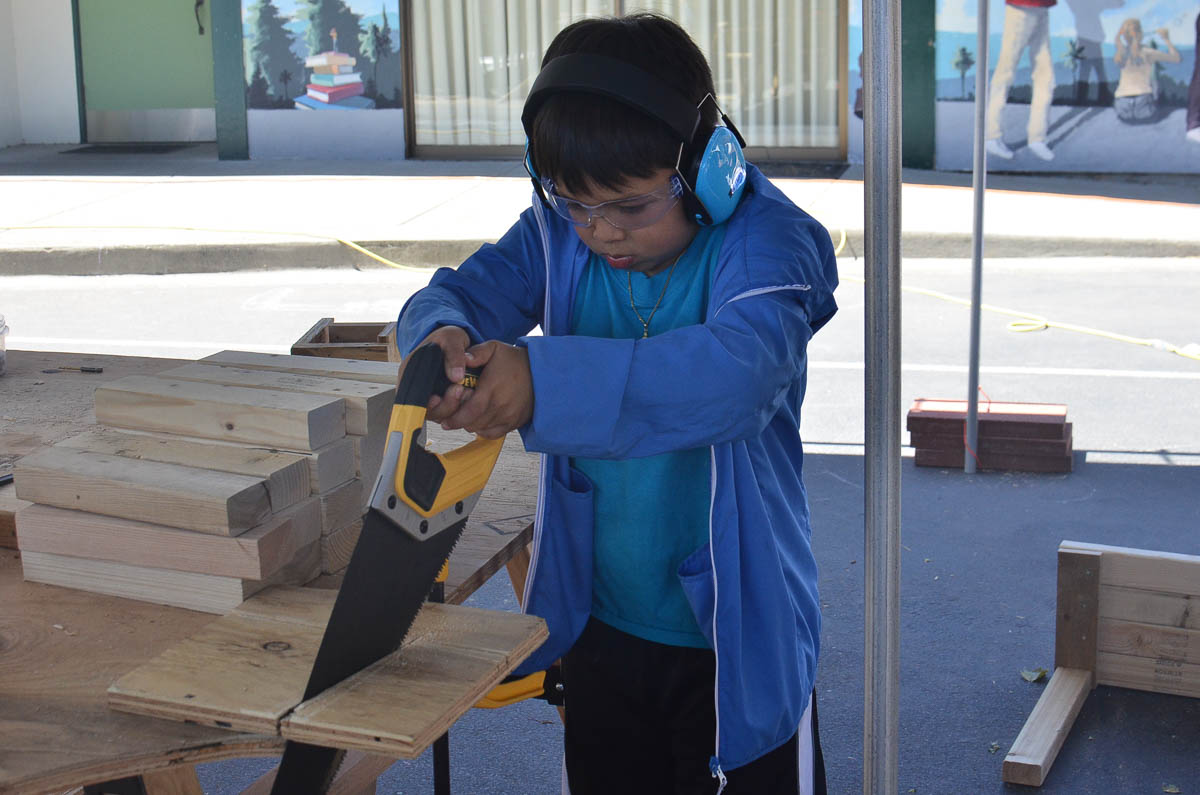  Eugene using the handsaw for part of his project. 