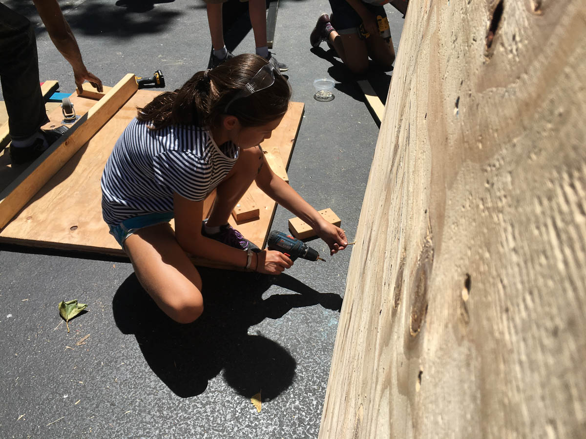  Katy makes some final adjustments to ensure the cart will move smoothly on the track. 