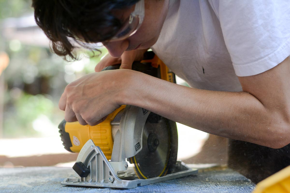 Zeke demonstrates his proficiency on the skilsaw.