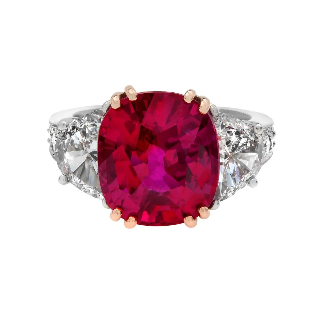 9.10 carat Cushion Cut Ruby Ring. Surrounding the center stone are 2.60 carats of Half-Moon Diamonds and Round Brilliant Cut Diamonds. Set in 18k yellow gold and platinum. 