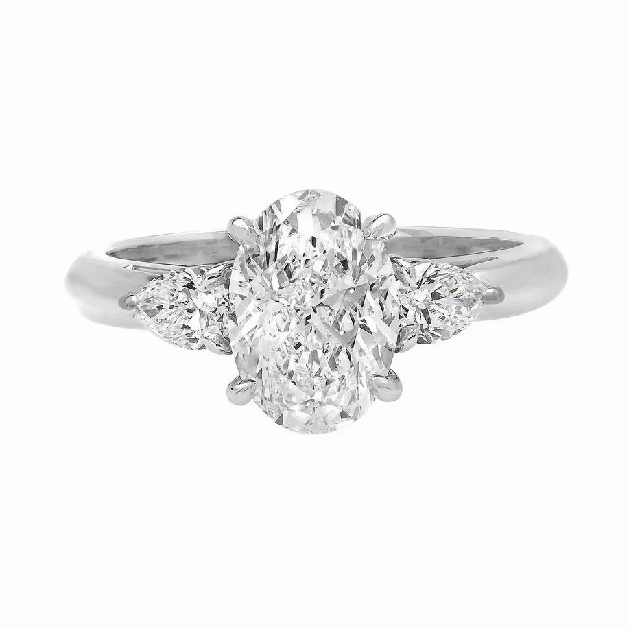 1.51 carat Pear Cut 3 stone Diamond Ring. 0.33 carats of Pear Diamonds on the sides of the center stone. Set in platinum.