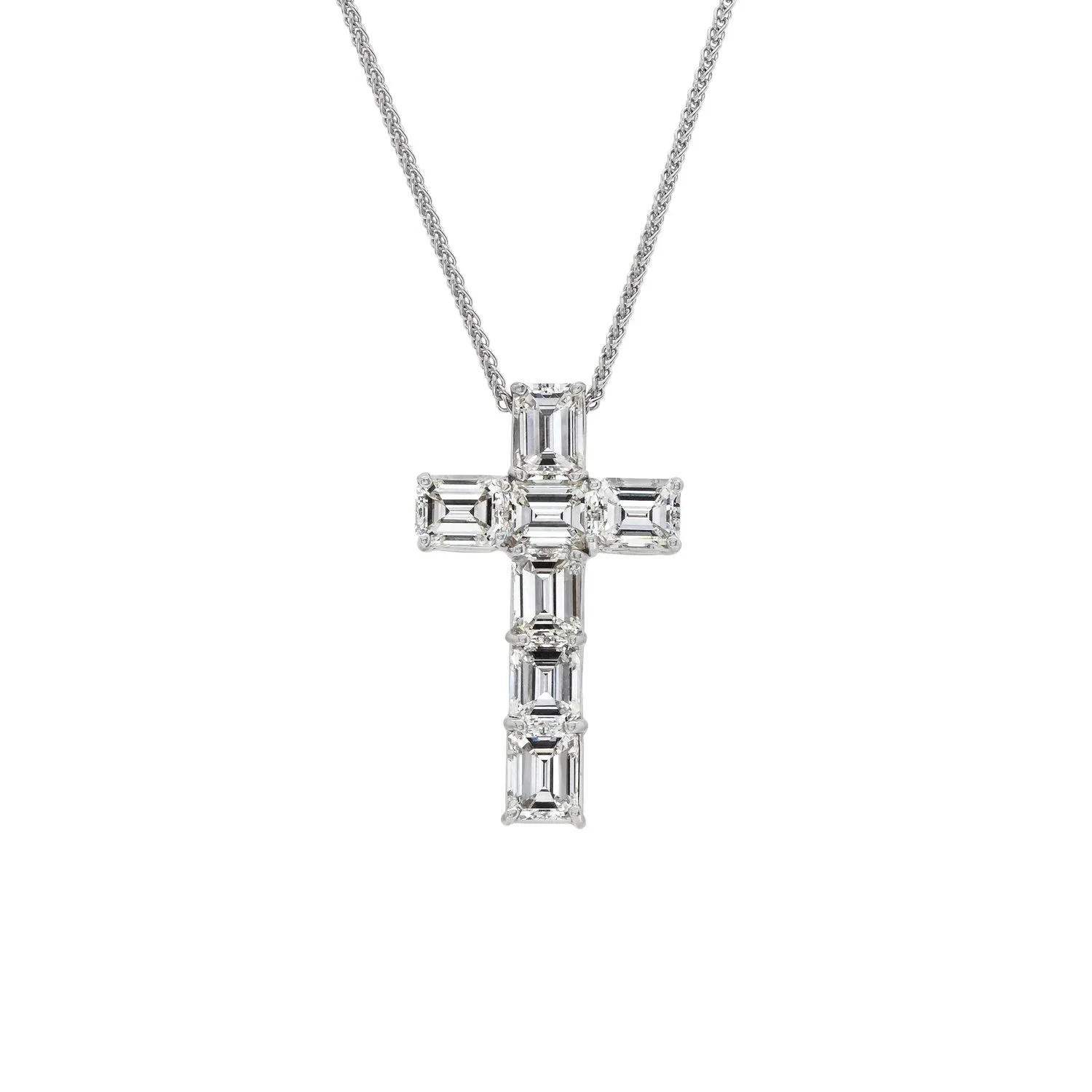Emerald Cut Diamond Cross Pendant; 5.32 carat total weight. Set in platinum.