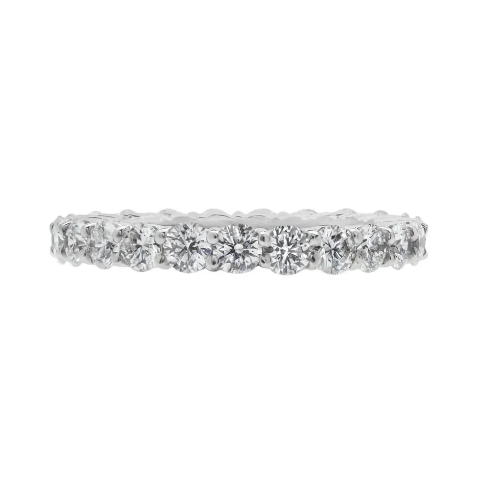 Classic Shared-prong Eternity Wedding Band; 1.95 carat total weight in Round Brilliant Cut Diamonds. Set in platinum.