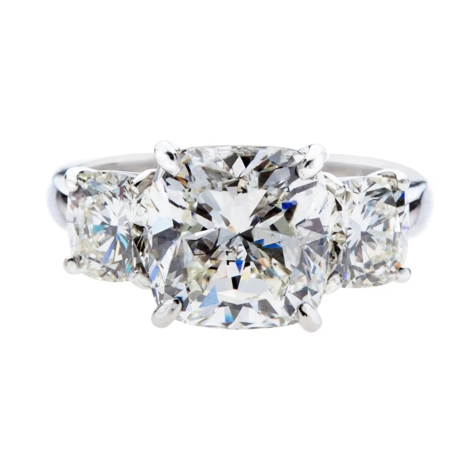 5.03 carat Cushion Cut 3-stone Diamond Ring; 7.09 carat total weight. Set in platinum.