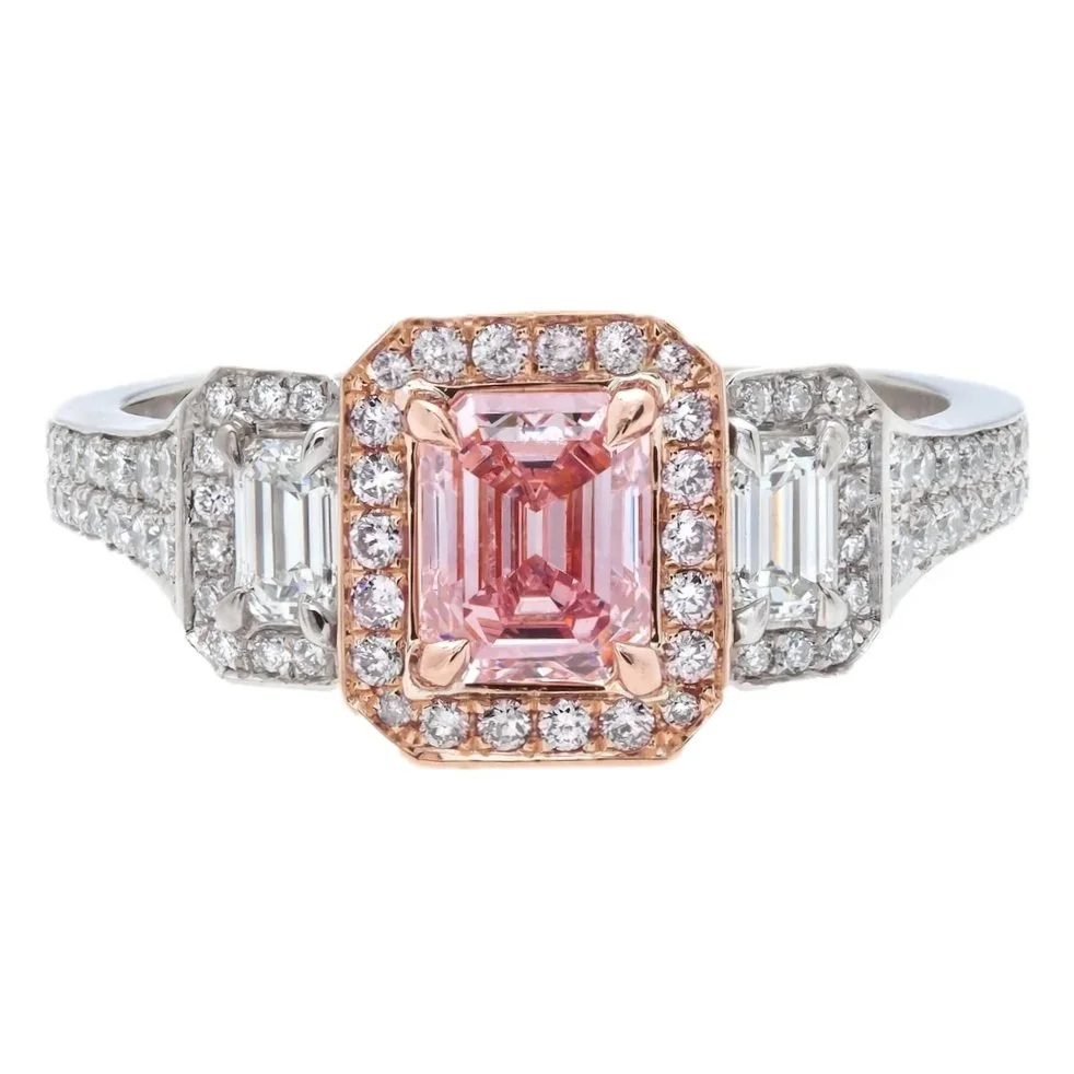Emerald Cut Fancy Intense Purplish/Pink Diamond 3-stone halo Ring. Emerald Cut Diamonds and 0.54 carats of Round Brilliant Cut Diamonds. Set in 18k rose gold and platinum.