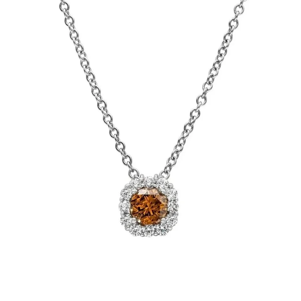 0.70 carat Round Fancy Deep Brownish-Yellowish Orange Diamond Pendant. 0.33&nbsp;carats of Round Brilliant Cut Diamonds surround the center stone. Set in 18k white gold.&nbsp;