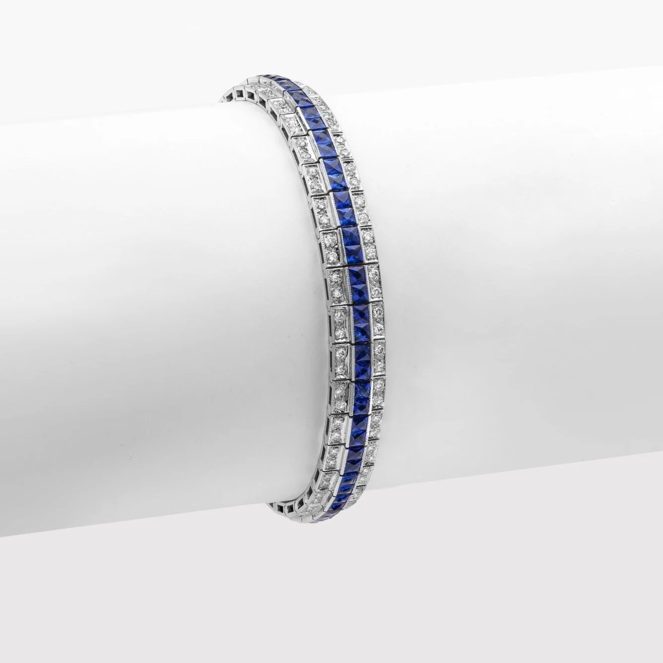 Sapphire and Diamond Bracelet; 11.20 carats of French Cut Sapphires and 2.32 carats of Round Brilliant Cut Diamonds. Set in 18k white gold.