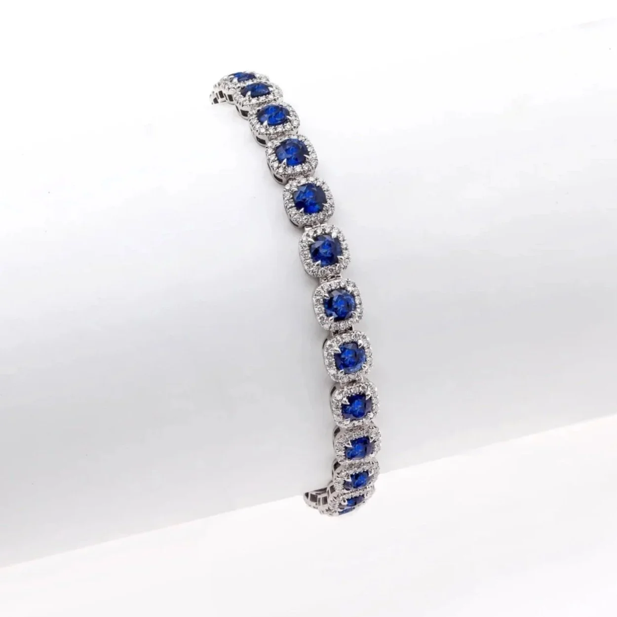 Sapphire and Diamond Cluster Bracelet; 13.38&nbsp;carats of Sapphires, surrounded by 3.12 carats of Round&nbsp;Brilliant Cut Diamonds. Set in platinum.​​​​​​​