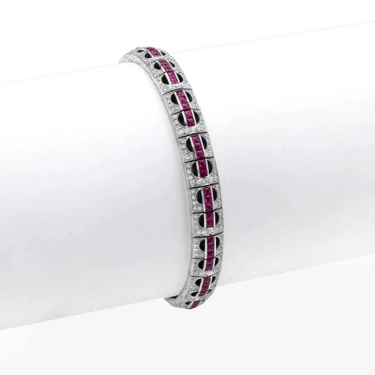 Ruby and Diamond Bracelet; 5.75 carats of French Cut Rubies and 1.58 carats of Round Brilliant Cut Diamonds. Set in 18k white gold.