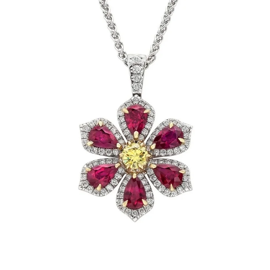 Fancy Vivid Yellow Diamond, Ruby, and Diamond cluster pendant.