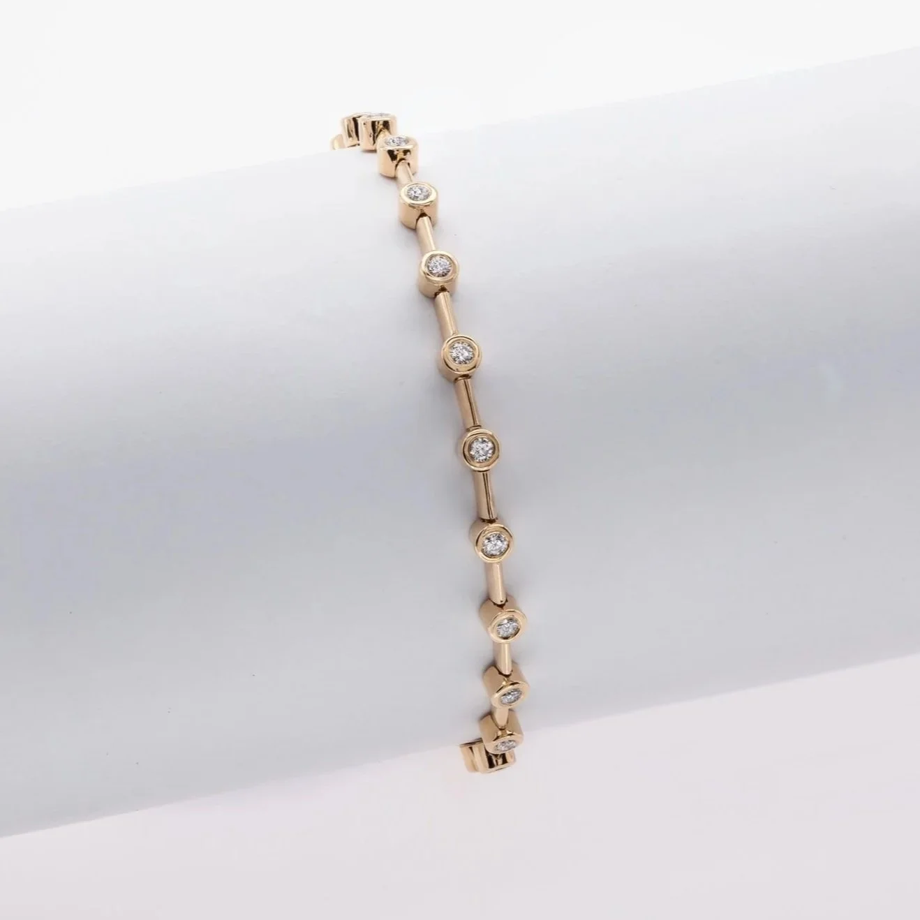 Stackable Bezel Bracelet; 1.09 carat total weight in Round Brilliant Cut Diamonds. Set in 18k yellow gold. 