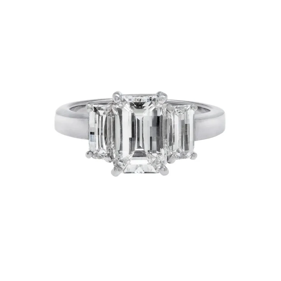 2.18 carat Signature Lighthouse Cut 3-stone Diamond Ring. 0.87 carats of Lighthouse Cut Diamonds surround the center stone. 3.05 carat total weight. Set in platinum.