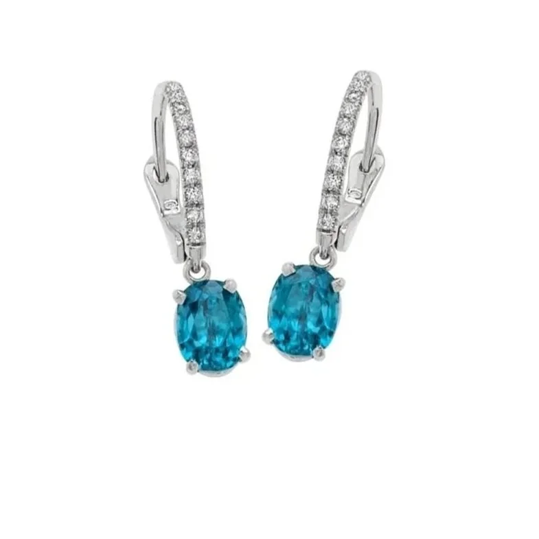 Blue Zircon Earrings; 3.36 Blue Zircon carat total weight and 0.12 Diamond Topper carat total weight. Set in 18k white gold. 
