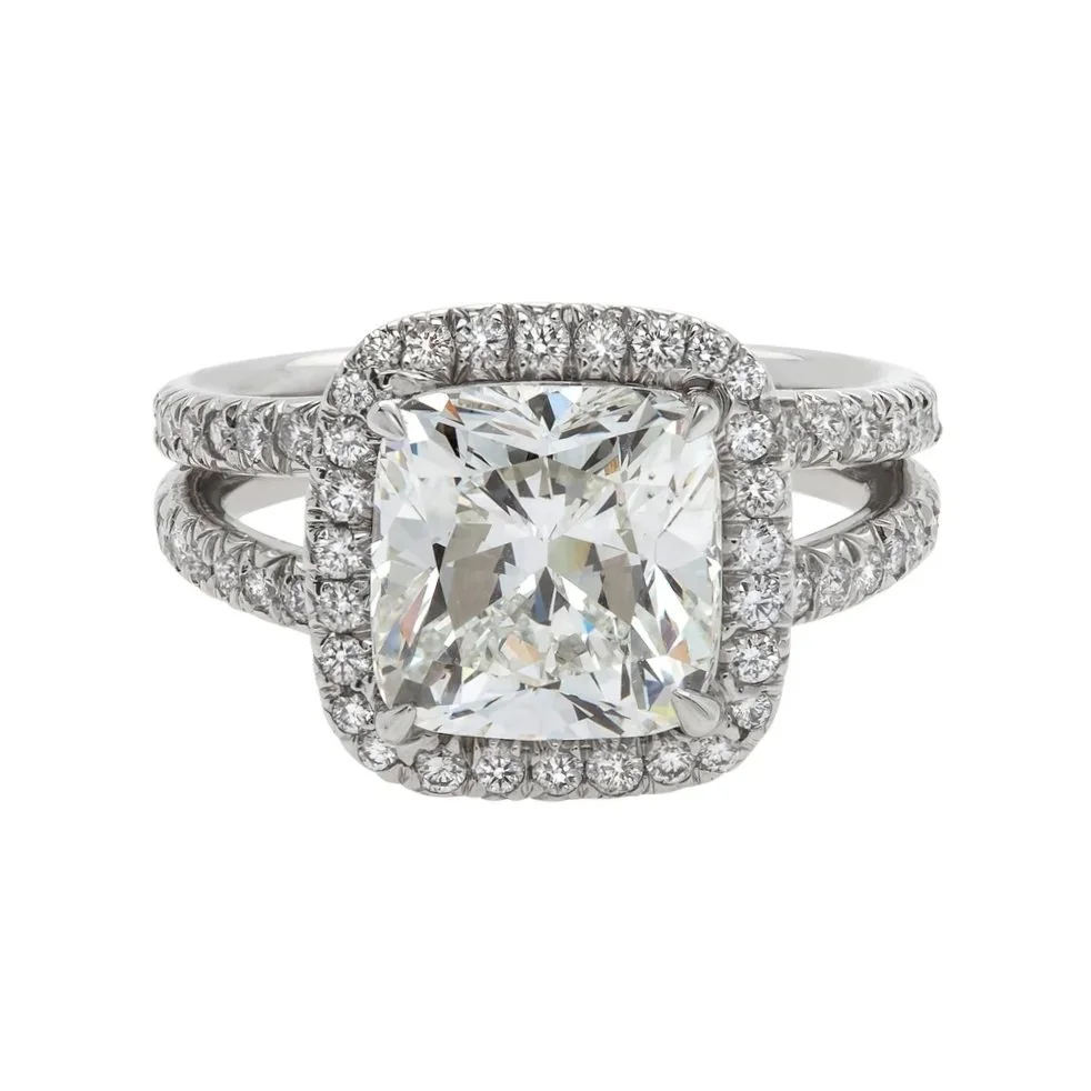 4.06 carat Cushion Cut Diamond Halo Splilt Shank Ring; 4.84 carat total weight. Set in platinum.
