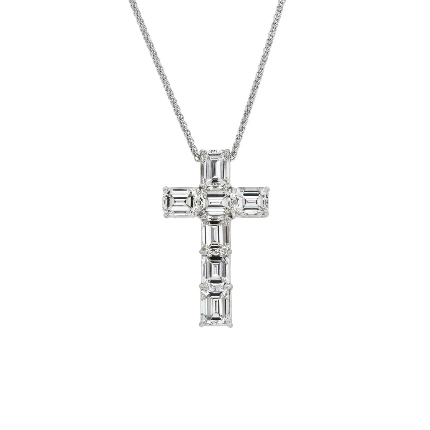 Emerald Cut Diamond Cross Pendant; 5.32 carat total weight. Set in platinum.