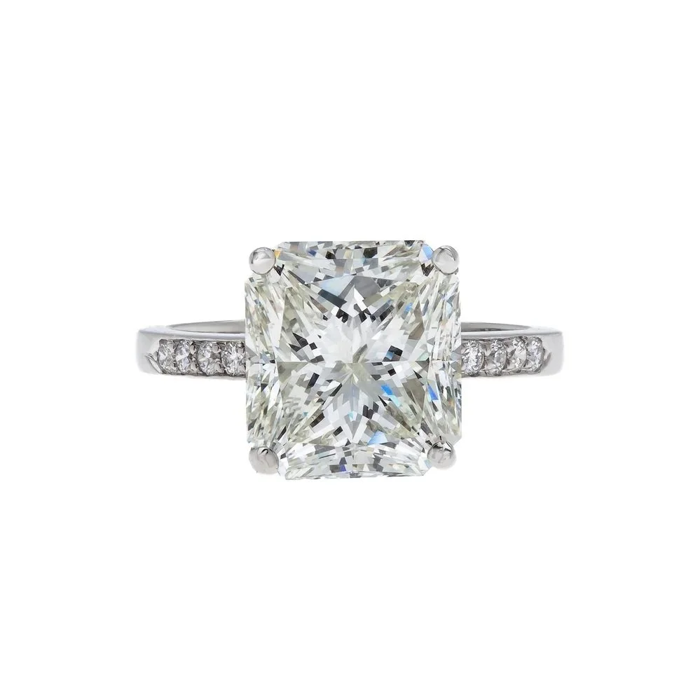 5.62 carat Radiant Cut Diamond Halo Ring; 6.58 carat total weight. Set in platinum.