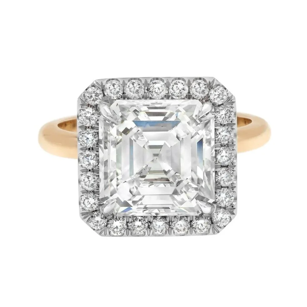 5.62 carat asscher Cut Diamond Halo Ring; 6.58 carat total weight. Set in platinum and 18k yellow gold.