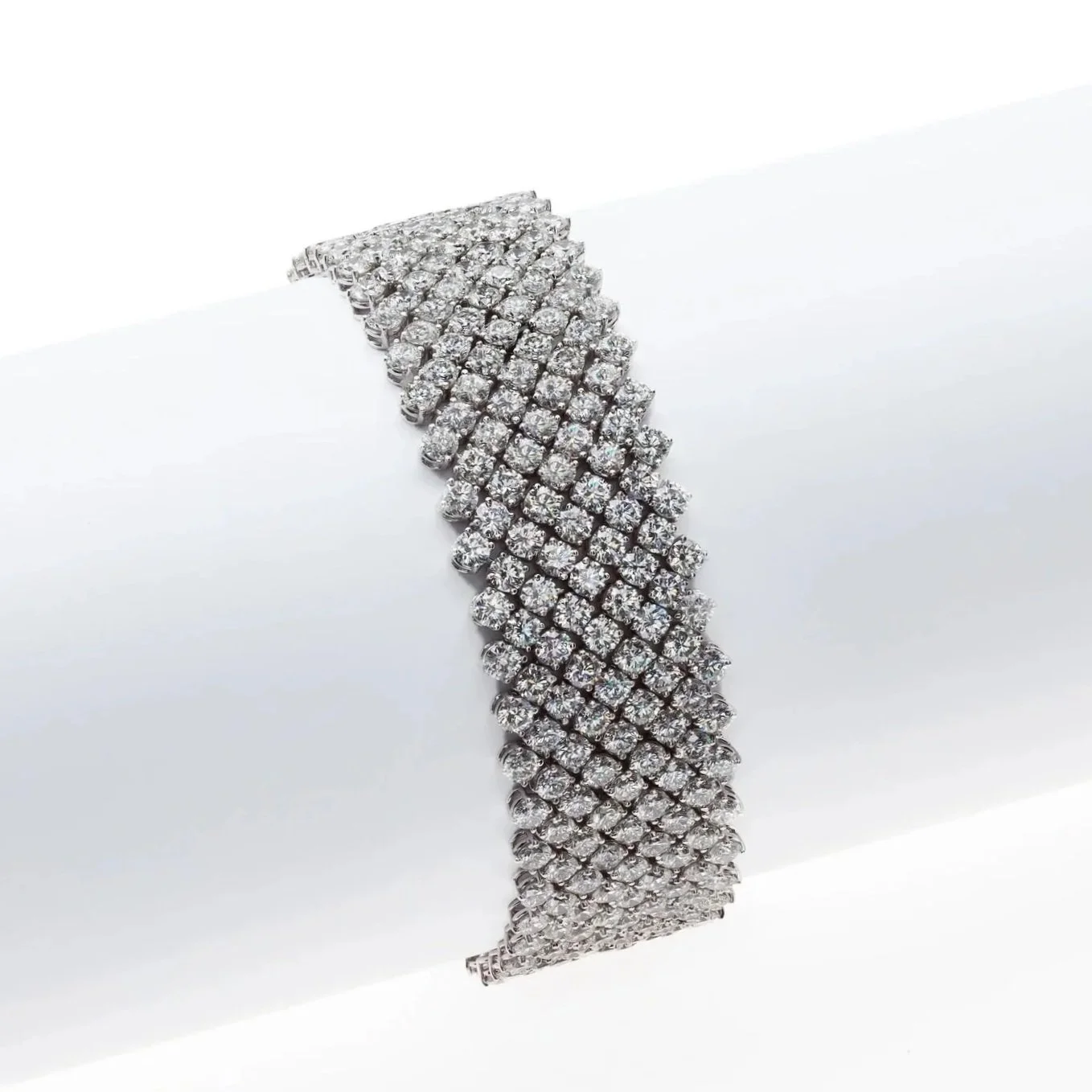 Signature Ribbon Bracelet; 46.45 carat total weight in Round Brilliant Cut Diamonds. Set in 18k white gold.