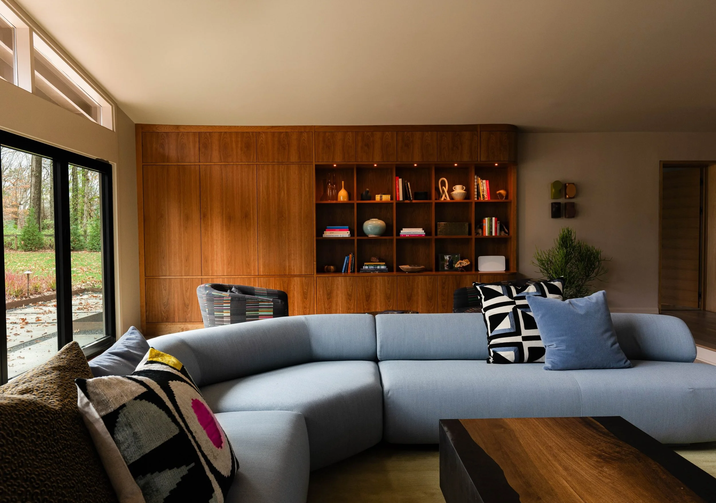 Two sides to every story. 

Both colorful, personal and connected. 

@morosofficial making the sexiest sofa with perfect curves. 
@ora.house.furniture cabinetry is the best back up dancer on stunning natural cherry. 
@iamsammccurdy art showing off to