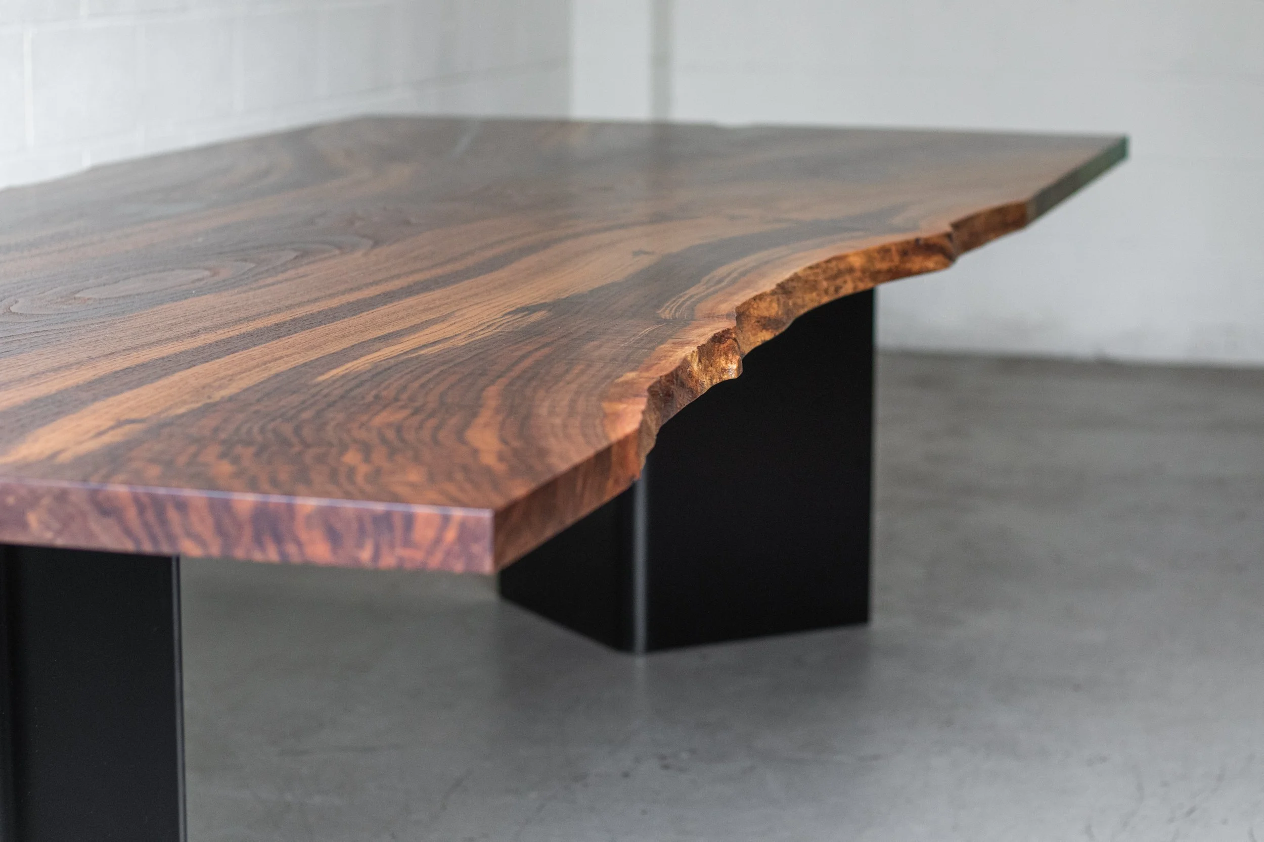 BOOKEND  |  Live Edge Walnut Slab Dining Table  |  Bent Plate Steel Legs