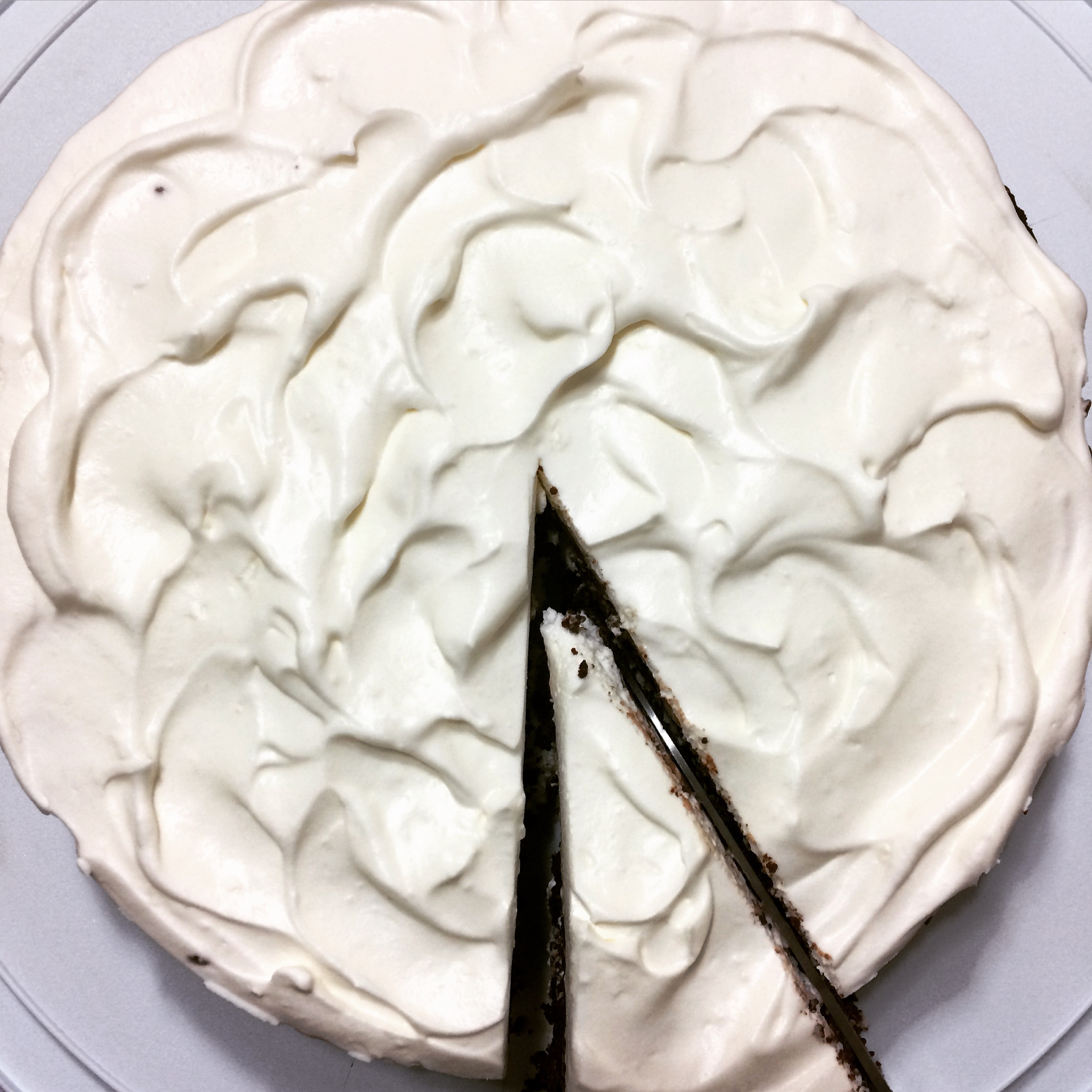 Flourless chocolate cake, fresh strawberries and whipped sour cream.