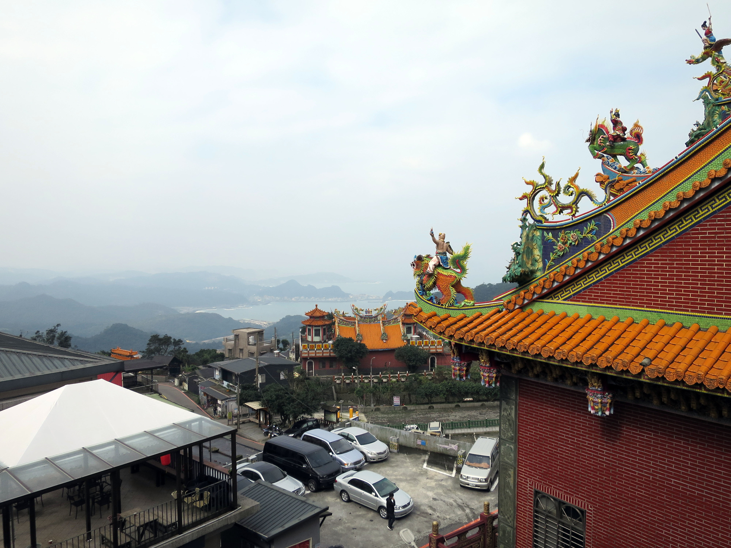 View from Jiufen bus stop. Temple roofs and the Pacific Ocean in Taiwan.
