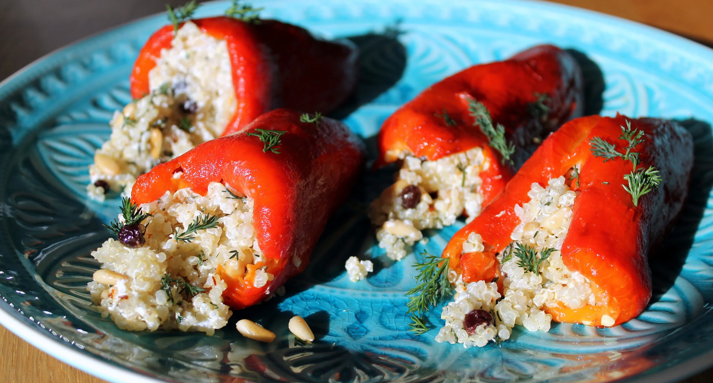 Quinoa-Stuffed Peppers with Dill, Currants, and Goat Cheese