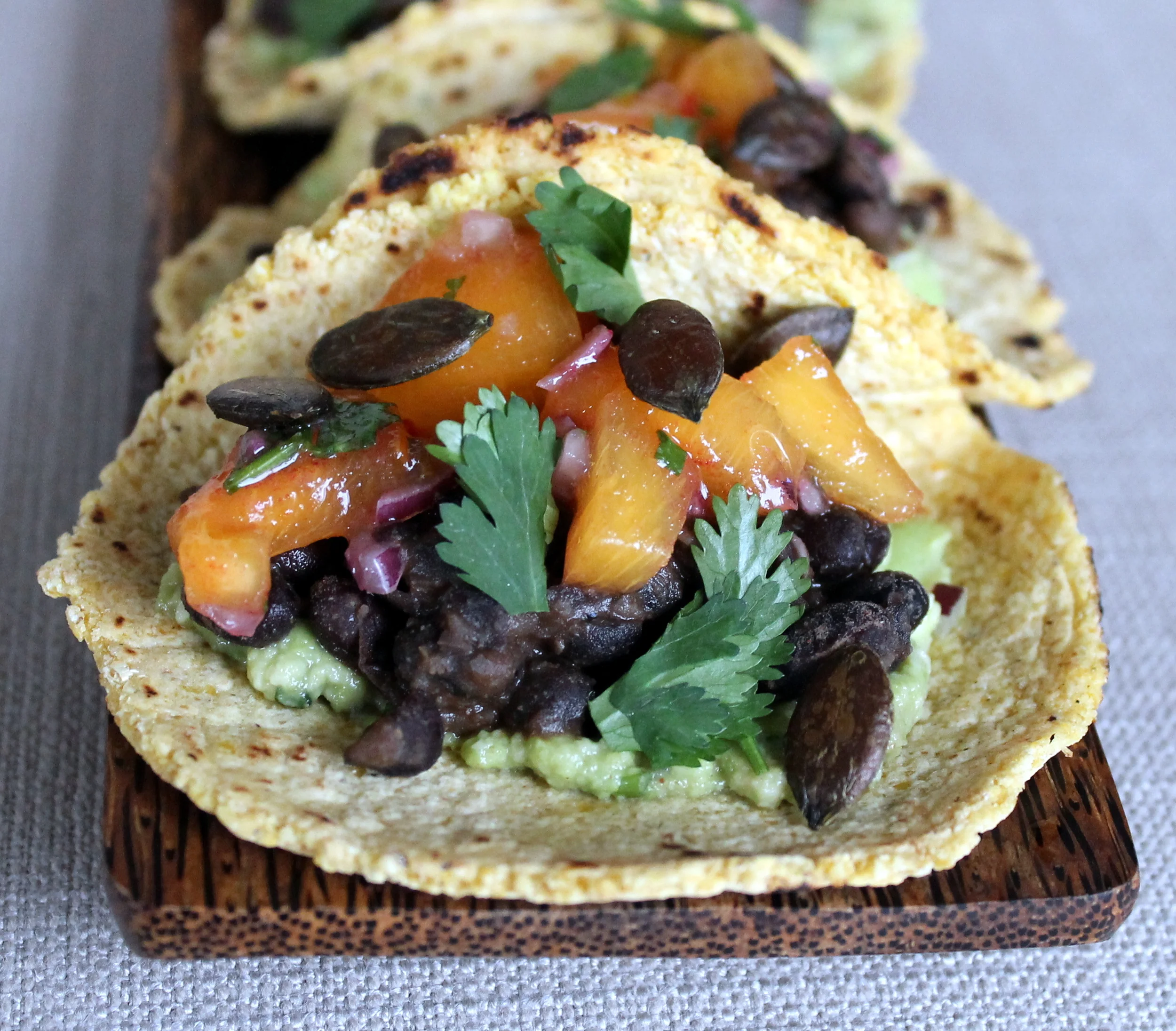 Smoky Guacamole Tacos with Persimmon Salsa