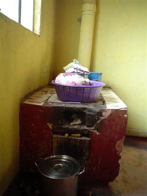 Wood stove with ventilation to the outside. Public health initiatives in Latin America and Africa work to educate and fund proper ventilation after studies revealed a correlation between early mortality from lung cancer and smoke accumulation indoors from wood stoves lacking proper ventilation.