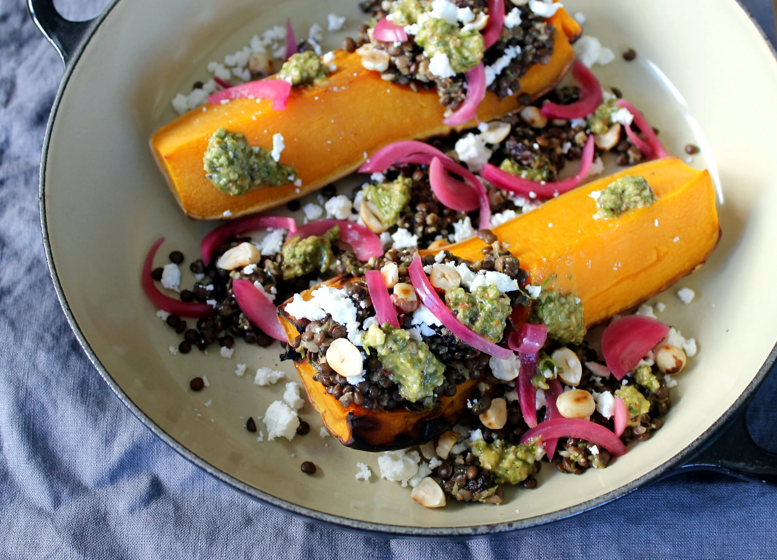 Lentil Stuffed Butternut Squash with Chive Hazelnut Pesto