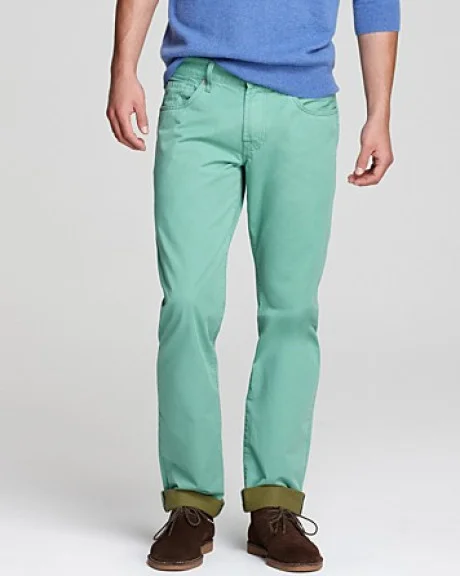blue-green jeans with dull brown suede bucks shoes. 