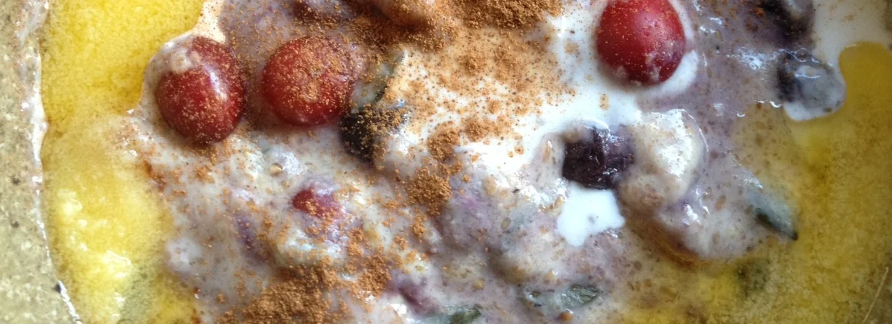 And there it is - flaxseed porridge with berries, cinnamon, nuts and seeds, coconut milk and homemade ghee