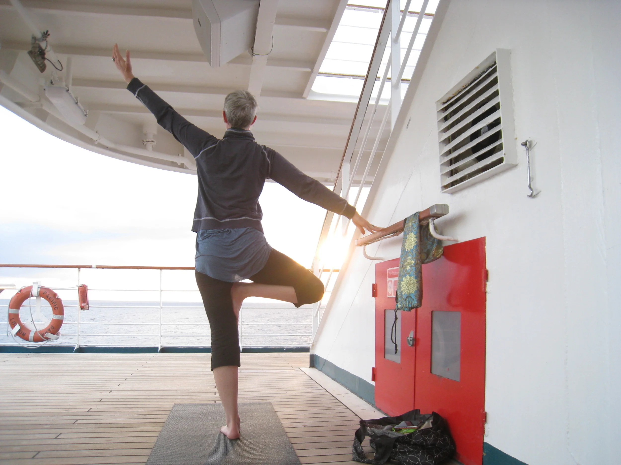 Keeping balance. Holding on in tree pose while sloshing around the Pacific