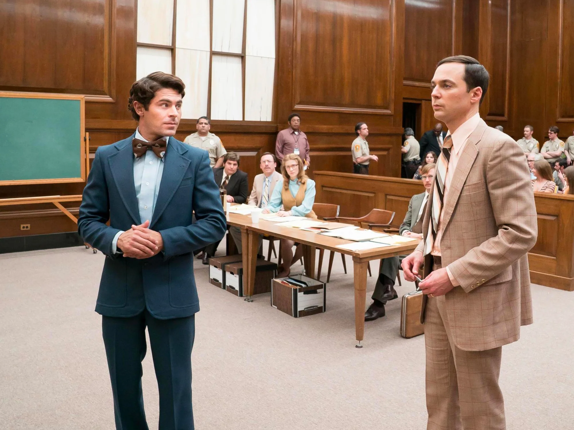 From left to right: Zac Efron as the infamous serial killer Ted Bundy and Jim Parsons as Floridian prosecution lawyer Larry Simpson in Extremely Wicked, Shockingly Evil, and Vile .