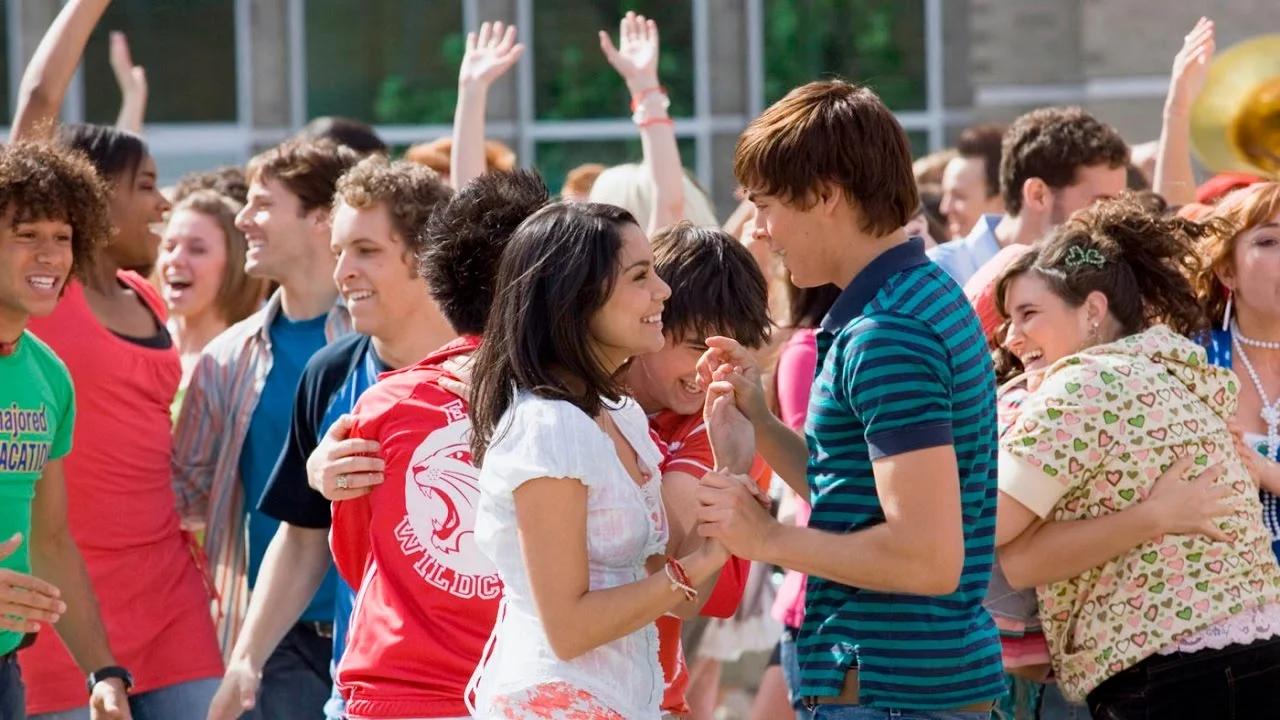 Vanessa Hudgens and Zac Efron play loved-up couple Gabriella and Troy in High School Musical 2 .