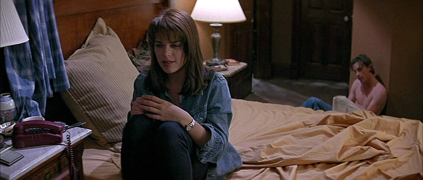 Neve Campbell and Skeet Ulrich fear the killer as Sidney and Billy in Scream .