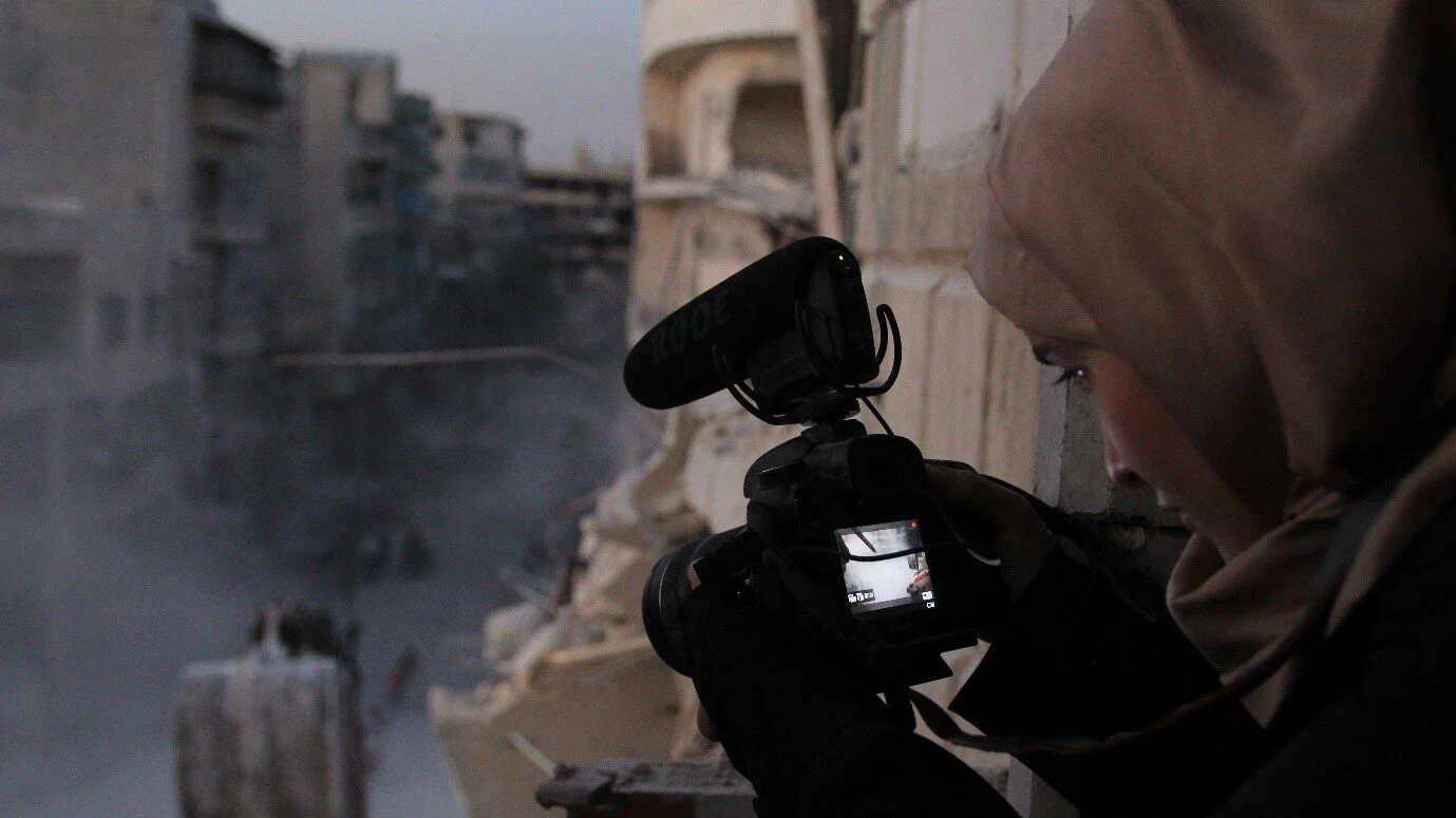 Waad Al-Khateab films amidst the rubble in For Sama .